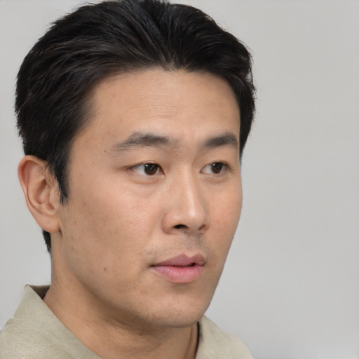 Neutral asian young-adult male with short  black hair and brown eyes