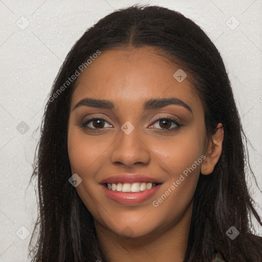 Joyful latino young-adult female with long  brown hair and brown eyes