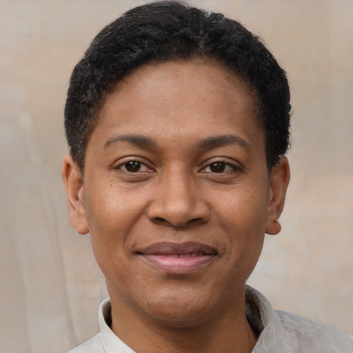 Joyful latino adult male with short  black hair and brown eyes