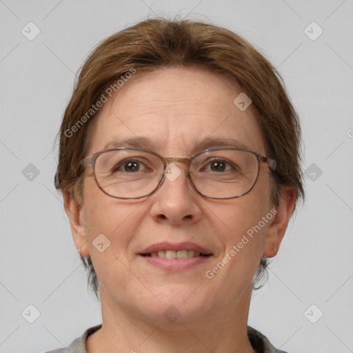 Joyful white adult female with short  brown hair and grey eyes