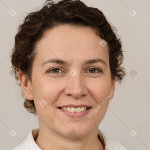 Joyful white adult female with short  brown hair and brown eyes