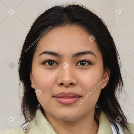 Joyful latino young-adult female with medium  brown hair and brown eyes