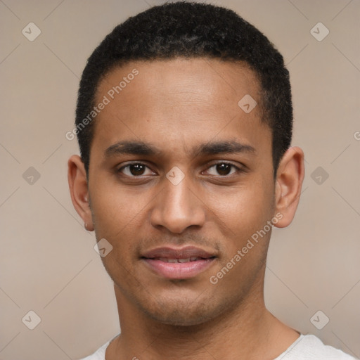 Joyful black young-adult male with short  brown hair and brown eyes