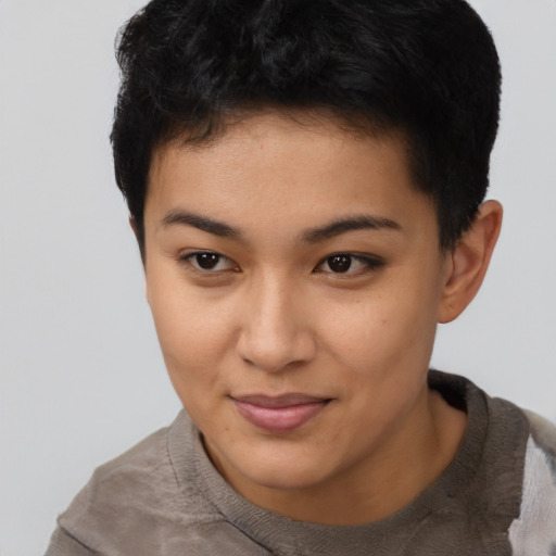 Joyful latino young-adult female with short  black hair and brown eyes