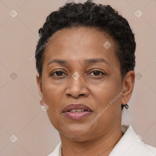 Joyful black adult female with short  brown hair and brown eyes