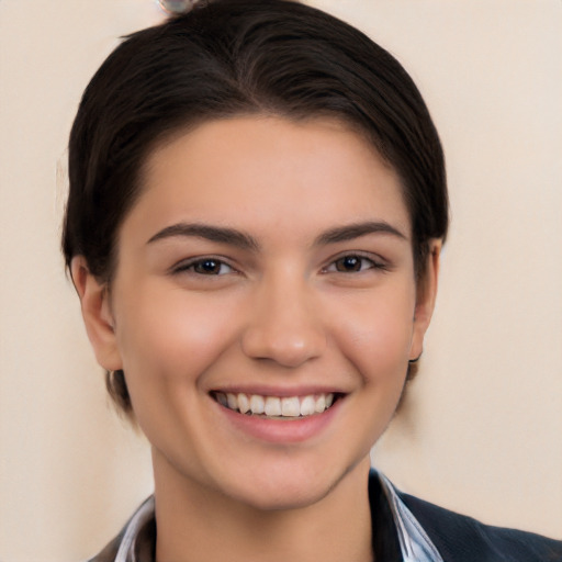 Joyful white young-adult female with medium  black hair and brown eyes