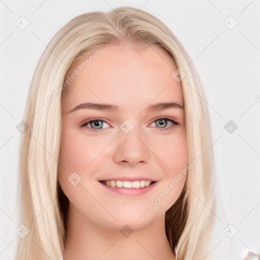 Joyful white young-adult female with long  brown hair and blue eyes