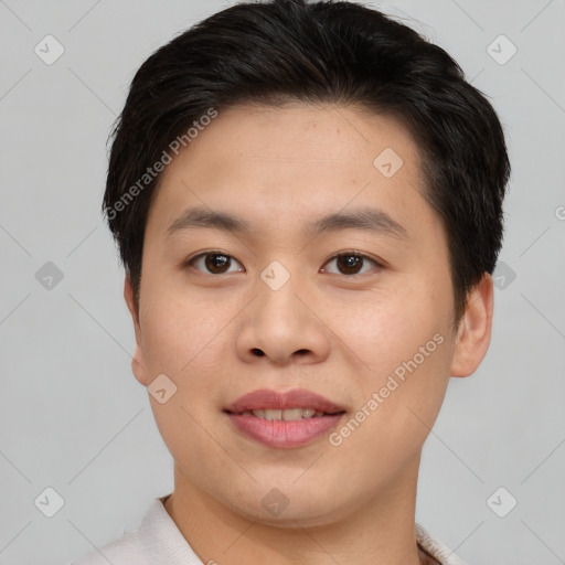 Joyful asian young-adult male with short  brown hair and brown eyes