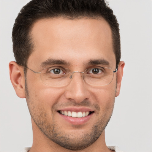 Joyful white young-adult male with short  brown hair and brown eyes