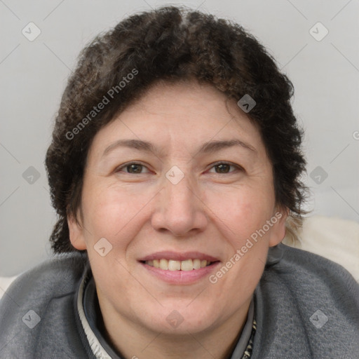 Joyful white adult female with short  brown hair and brown eyes