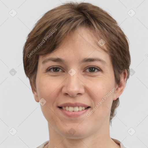 Joyful white adult female with medium  brown hair and grey eyes