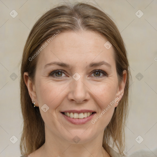 Joyful white adult female with medium  brown hair and grey eyes