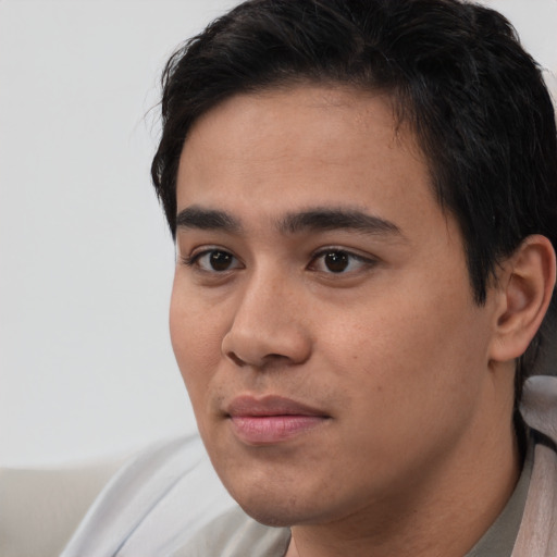 Neutral white young-adult male with short  black hair and brown eyes