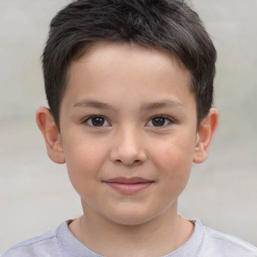 Joyful white child male with short  brown hair and brown eyes
