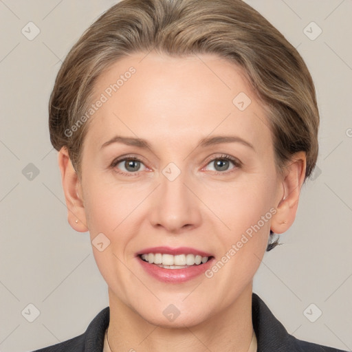 Joyful white adult female with short  brown hair and grey eyes