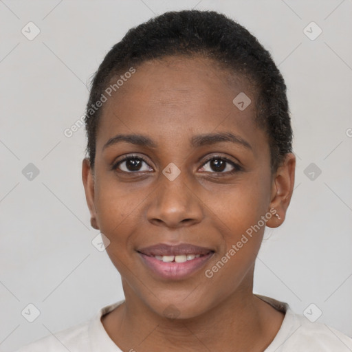 Joyful black young-adult female with short  brown hair and brown eyes