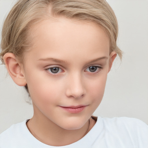 Joyful white child female with short  brown hair and blue eyes