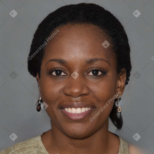 Joyful black young-adult female with short  black hair and brown eyes