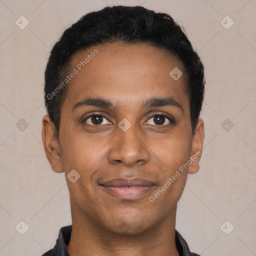 Joyful black young-adult male with short  black hair and brown eyes