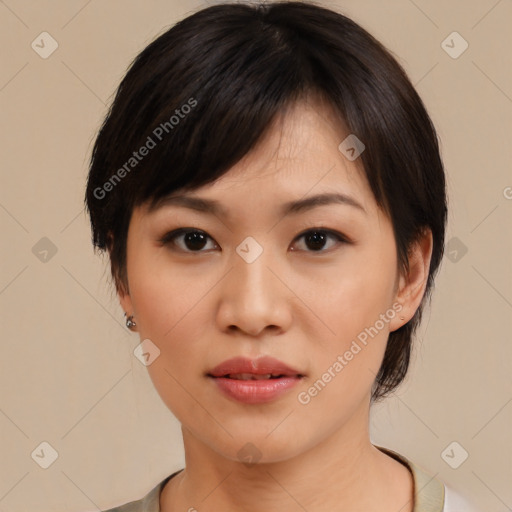 Joyful asian young-adult female with medium  black hair and brown eyes