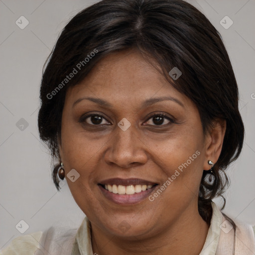 Joyful latino adult female with medium  brown hair and brown eyes