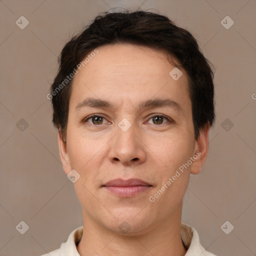 Joyful white adult male with short  brown hair and brown eyes