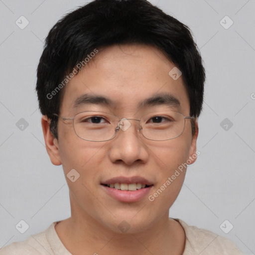 Joyful asian young-adult male with short  brown hair and brown eyes