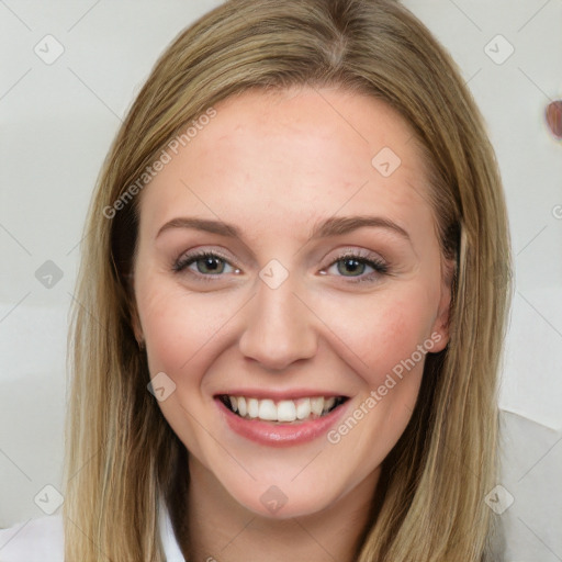 Joyful white young-adult female with long  brown hair and blue eyes