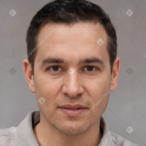 Joyful white adult male with short  brown hair and brown eyes