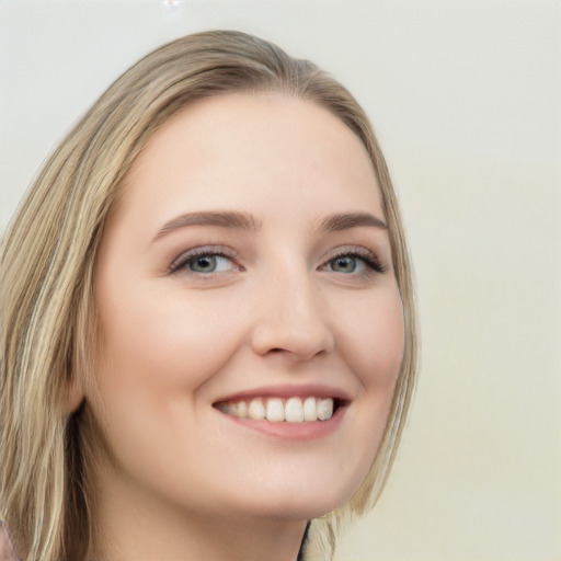 Joyful white young-adult female with long  brown hair and green eyes