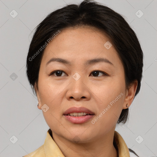 Joyful white adult female with medium  brown hair and brown eyes