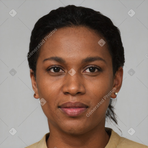 Joyful black young-adult female with short  black hair and brown eyes