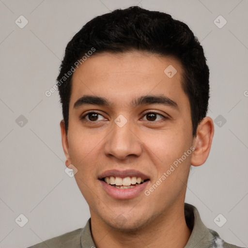 Joyful white young-adult male with short  black hair and brown eyes