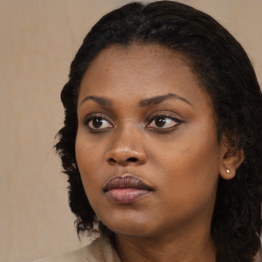 Neutral black young-adult female with long  black hair and brown eyes