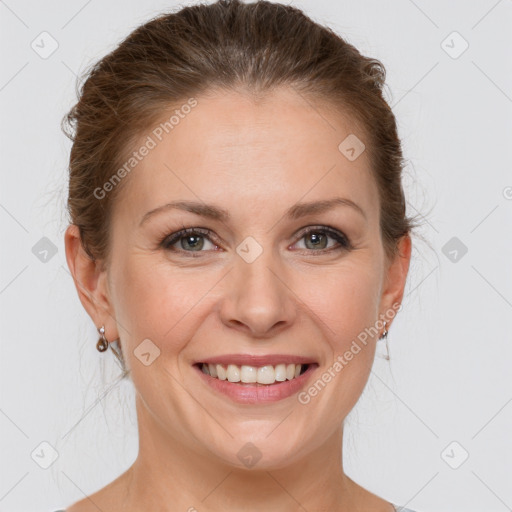 Joyful white adult female with medium  brown hair and grey eyes