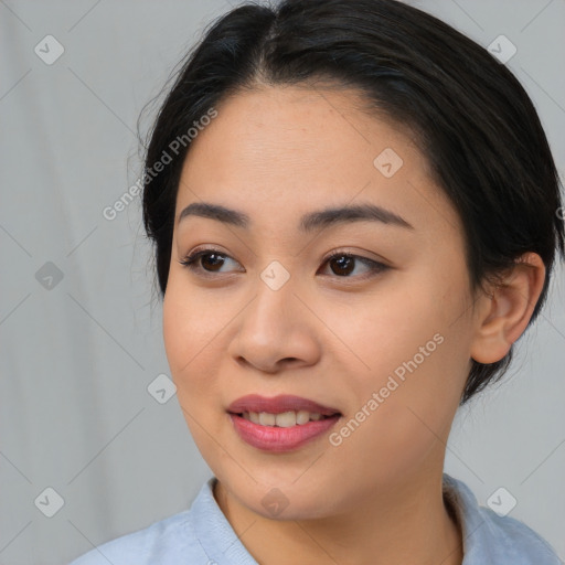 Joyful asian young-adult female with medium  black hair and brown eyes