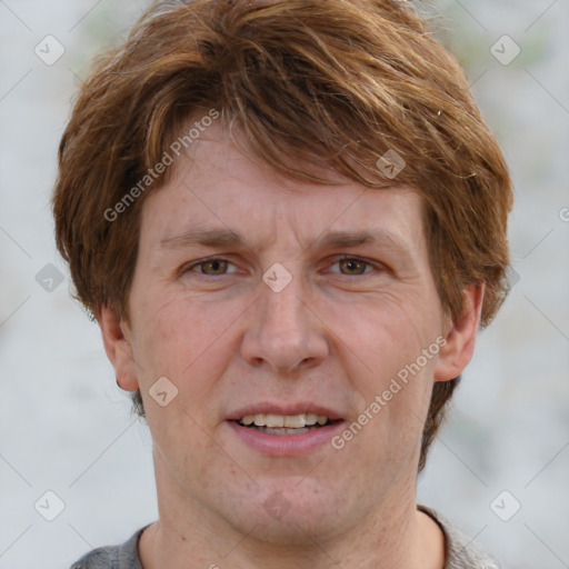 Joyful white adult male with short  brown hair and grey eyes