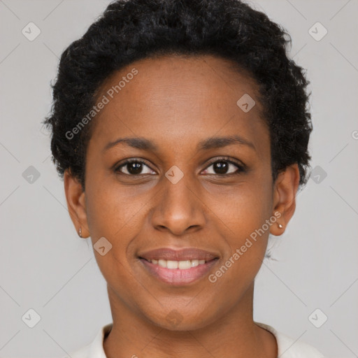 Joyful black young-adult female with short  brown hair and brown eyes