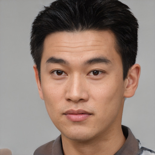 Neutral asian young-adult male with short  brown hair and brown eyes