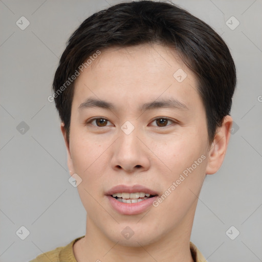 Joyful asian young-adult male with short  brown hair and brown eyes