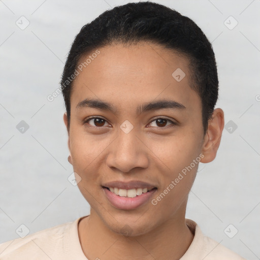 Joyful latino young-adult male with short  brown hair and brown eyes