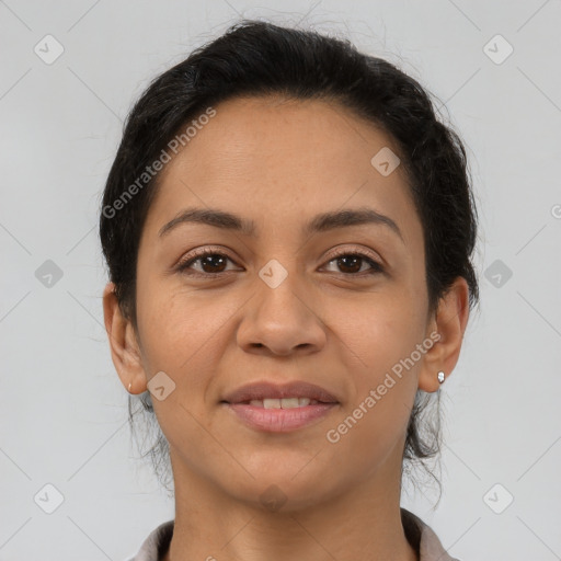 Joyful latino young-adult female with medium  brown hair and brown eyes