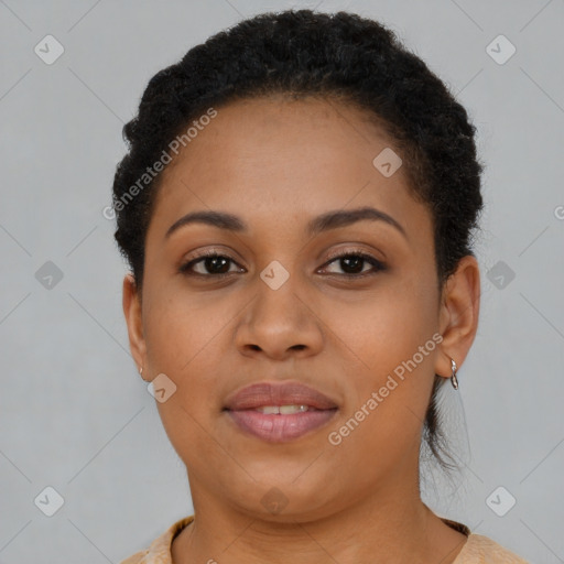 Joyful black young-adult female with short  brown hair and brown eyes