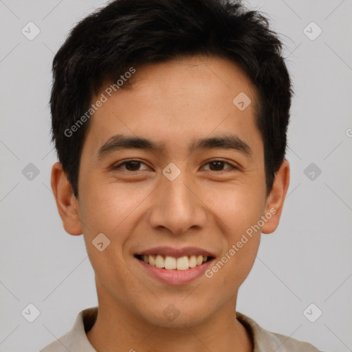 Joyful latino young-adult male with short  brown hair and brown eyes