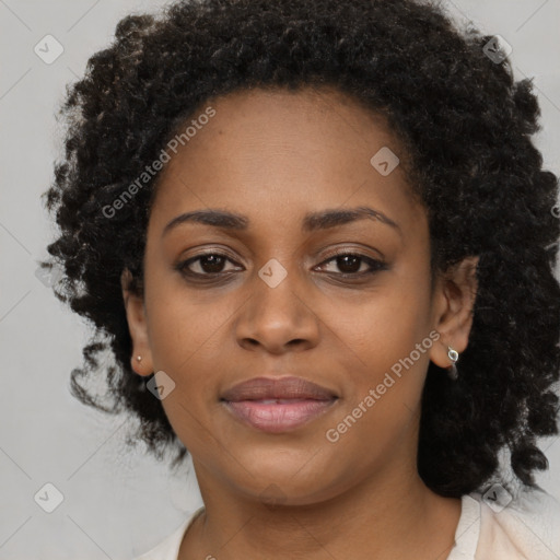 Joyful black young-adult female with medium  black hair and brown eyes