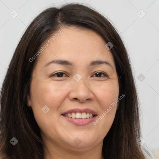 Joyful white adult female with long  brown hair and brown eyes