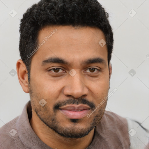 Joyful latino young-adult male with short  brown hair and brown eyes