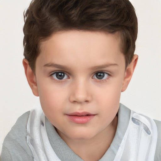 Joyful white child male with short  brown hair and brown eyes