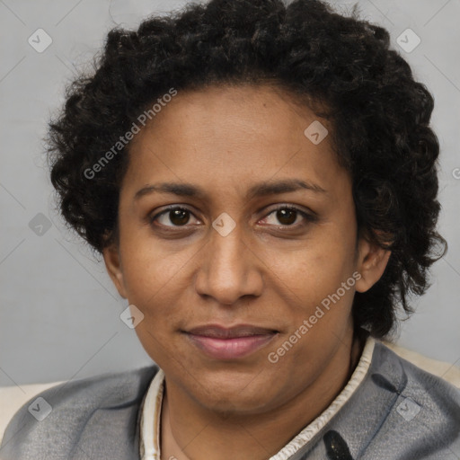 Joyful black adult female with short  brown hair and brown eyes