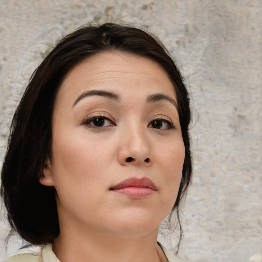 Neutral asian young-adult female with medium  brown hair and brown eyes
